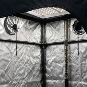 Close-up texture of high-density diamond mylar lining inside a big grow tent reflecting indoor plant lighting.
